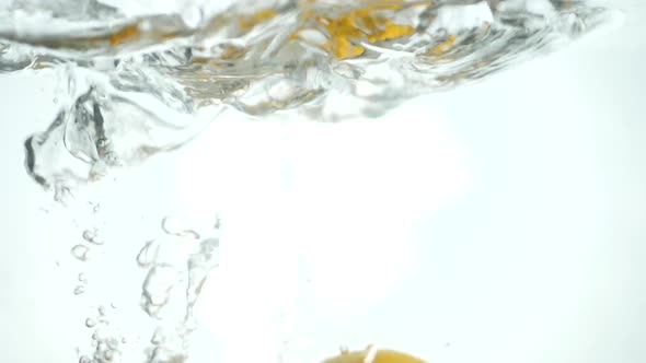 Orange Fruit Falls Under Water