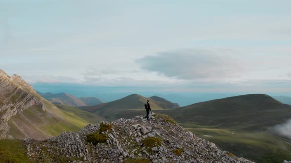 Drone Shot of Hiker on Mountain Cloudy Top