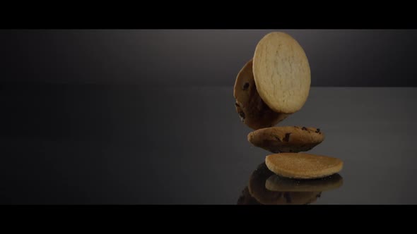 Falling cookies from above onto a reflective surface - COOKIES 232