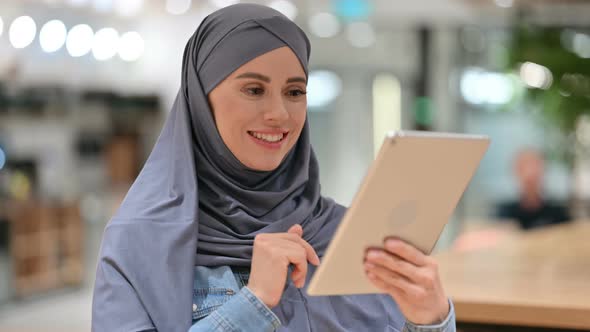 Online Video Call on Tablet By Arab Woman 