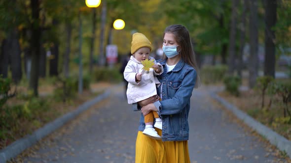 Masked Mother Holds Hand Lovely Daughter on Street Walk During Second Wave Quarantine Coronavirus