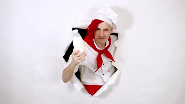 A Handsome Man with Red Dreadlocks Holds It in His Hand Milk