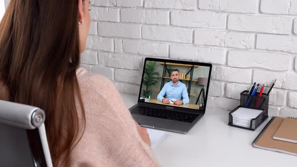 Woman study at home online by conference video call laptop greets speak teacher