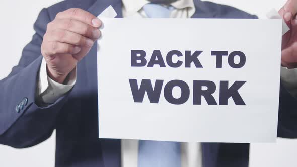 Businessman Posts Sign On Window Back To Work