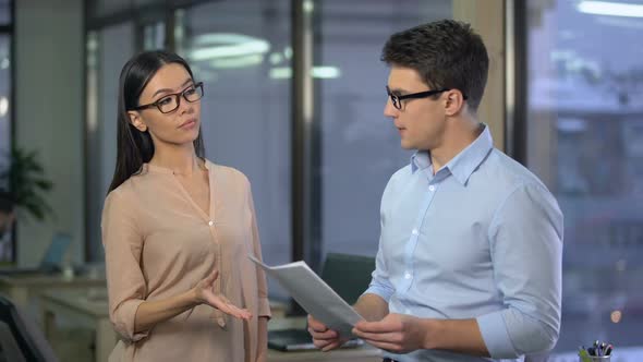 Strict Lady Boss Unhappy With Work of Young Trainee, Checking His Report, Fail