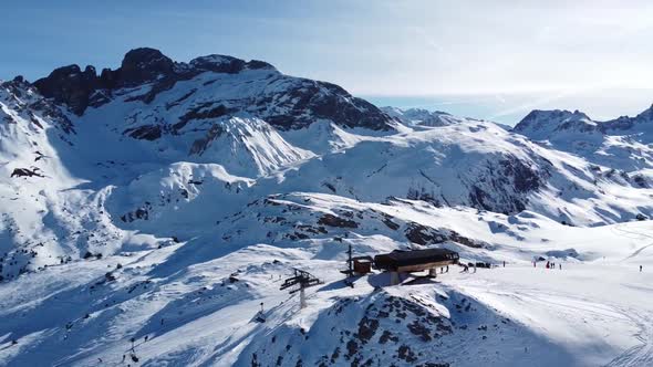 Aerial View of the Alps Mountains in France. Mountain Tops Covered in Snow. Alpine Ski Facilities