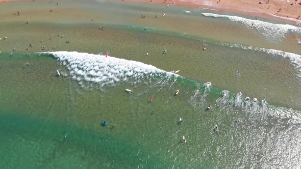 Top Down Aerial Shot of Newbie Surfers in a Sea