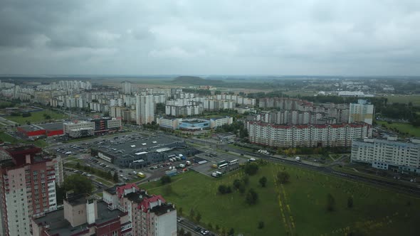 Flight over the city block in cloudy weather.