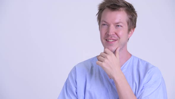 Face of Happy Young Man Patient Thinking and Looking Up