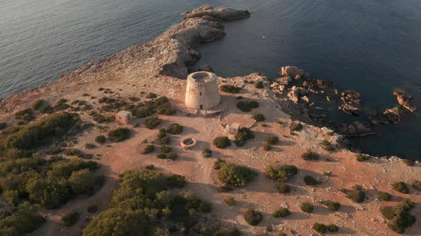 Flying towards pirate lookout tower in Ibiza.