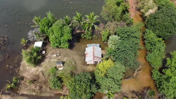 Houses And Farm Field Surrounded With Floodwaters In Battambang, Cambodia - Aerial Top View