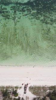 Vertical Video Boats in the Ocean Near the Coast of Zanzibar Tanzania