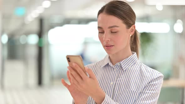 Portrait of Young Woman Using Smartphone 