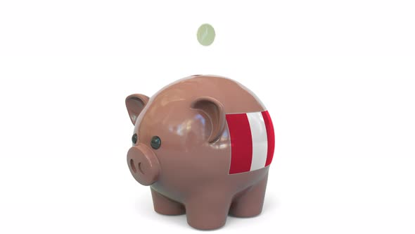 Putting Money Into Piggy Bank with Flag of Peru