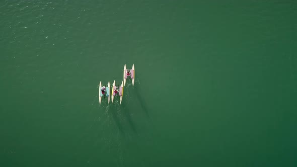 Aerial view people on water bike pedal boats in Greece.