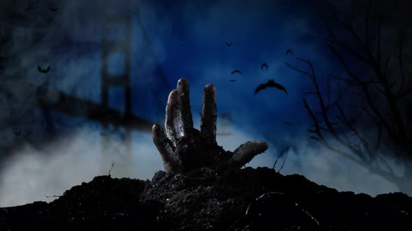 In the San Francisco Cemetery, a Hand Emerges From the Grave. Smoky Background