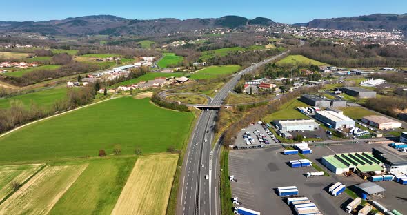 Aerial View of Goods Warehouses and Logistics Center in Industrial City Zone From Above