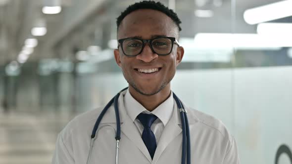 Portrait of Cheerful African Male Doctor Smiling at the Camera