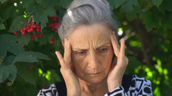 Tired Senior Grey Haired Woman is Feeling Bad Due to Menopause Menopause Relief Concept Standing