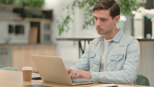 Creative Young Man Closing Laptop Going Away From Office