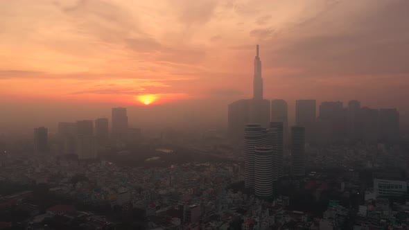 Ho Chi Minh City early morning aerial panorama with fog over Binh Thanh District featuring sunrise,