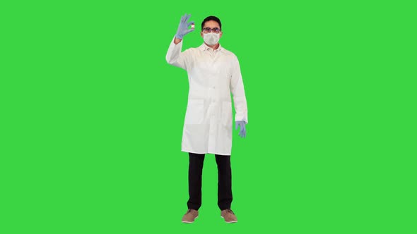 Virologist Shows a Developed COVID19 Vaccine on a Green Screen Chroma Key