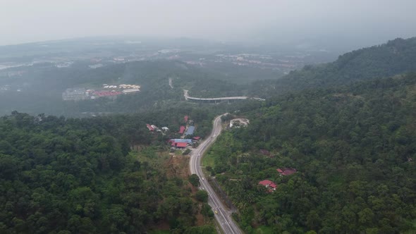 Aerial view main asphalt road cross plantation toward Balik Pulau