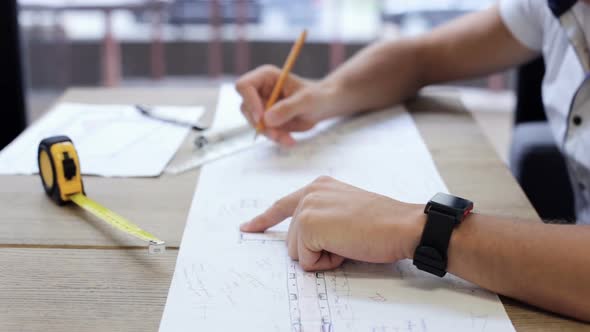 A civil engineer designs and works on drawings and analyzes the structure of a project.