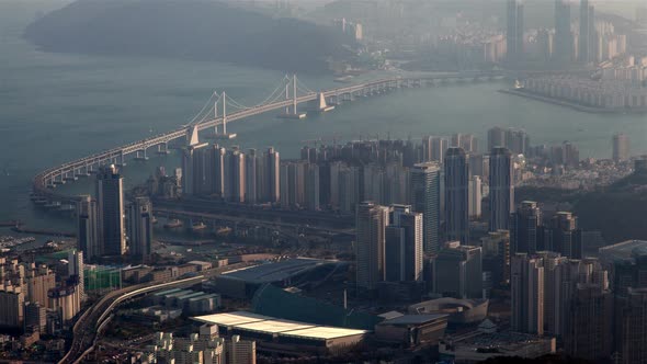 Timelapse Busan Bay with Highway and Bridge in Morning Mist