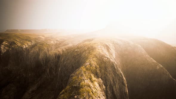 Dry Yellow Grass on the Rocky Mountain with Heavy Fog