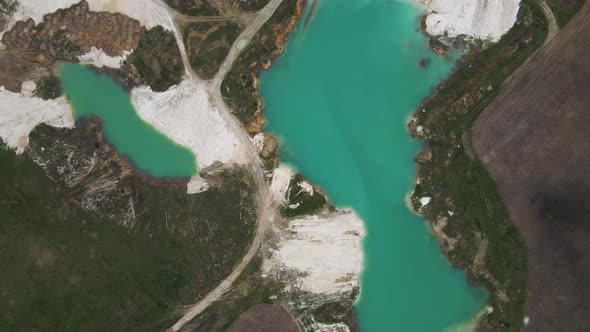 Aerial drone view Amazing industrial landscape, on Emerald lake in a flooded quarry