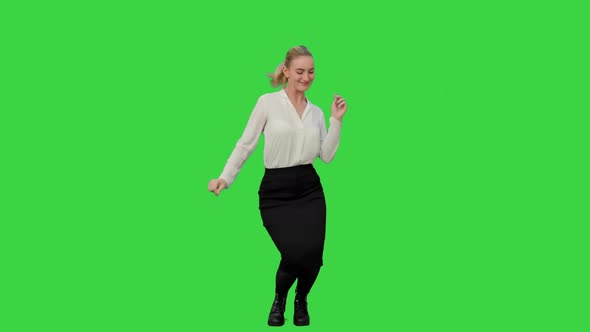 Businesswoman Dancing Wildly Celebrating Successful Project on a Green Screen