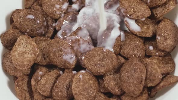 Chocolate Flavoured Cornflakes and Pouring Milk