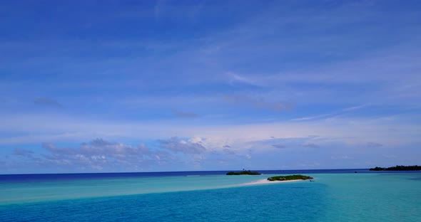 Luxury drone copy space shot of a white sand paradise beach and blue water background in high resolution