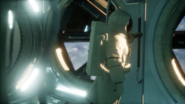 Astronaut Inside the Orbital Space Station alt