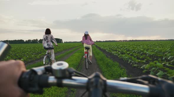 Family Rides Bikes in the Countryside