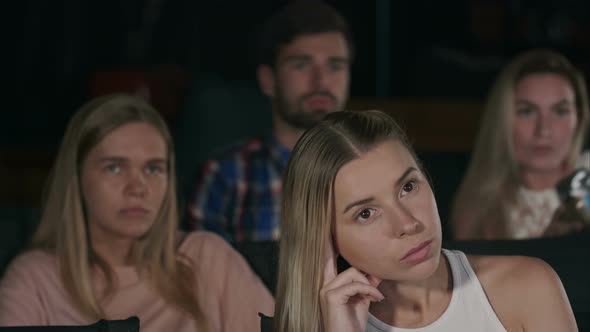 Young Girl at the Cinema Watching a Movie