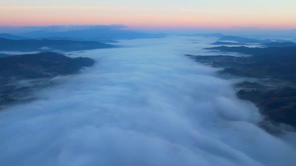 4K Sun is rising above sea of clouds until the horizon