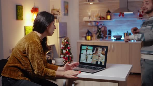Business Woman Using Video Call on Laptop Working on Christmas Eve
