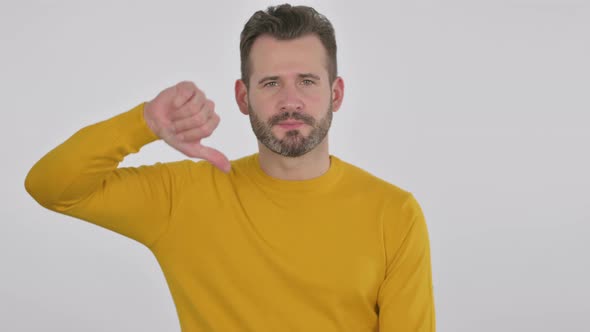 Portrait of Middle Aged Man Showing Thumbs Down Gesture