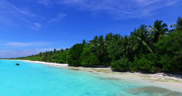 Daytime drone abstract shot of a white paradise beach and blue ocean background in colorful 4K