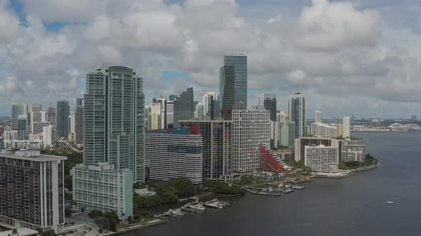 Aerial heading towards downtown Miami while increasing in altitude