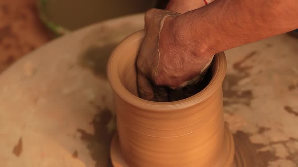 Potter at Work Makes Ceramic Dishes