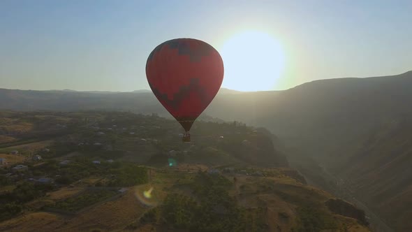 Colorful Hot Air Balloon Flying Over Halidzor Village at Sunset, Landscape