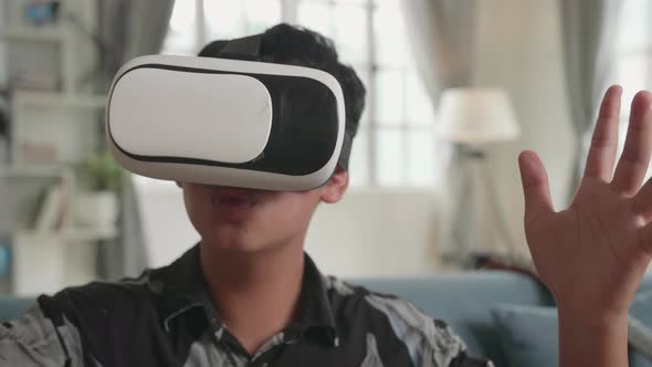 Asian Boy Explores Virtual Reality World