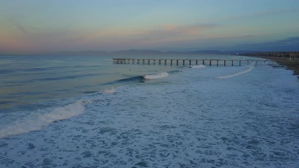 Aerial drone uav view of a pier, beach and ocean.