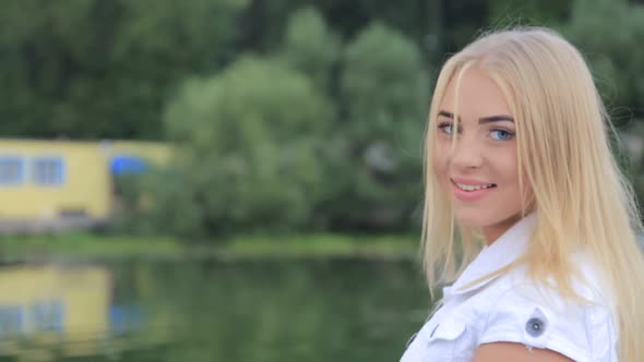 Beautiful Young Woman in the Summer Garden