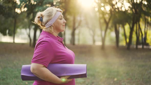 Tired Mature Woman Running in the Park