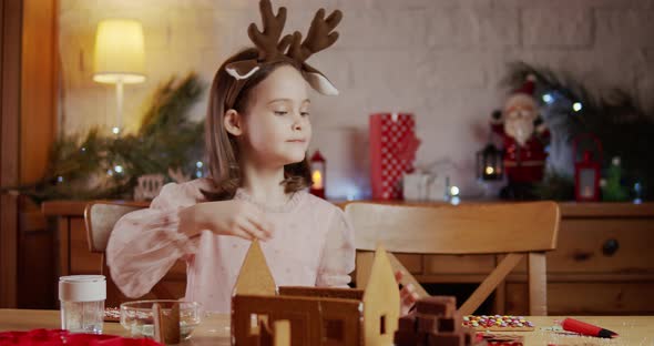 Cute Girl Build and Decorate Gingerbread Christmas House