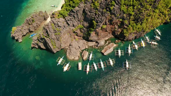 Aerial View of Boats and Limestone Cliffs. El Nido, Philippines